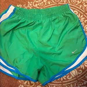 Green Nike running shorts